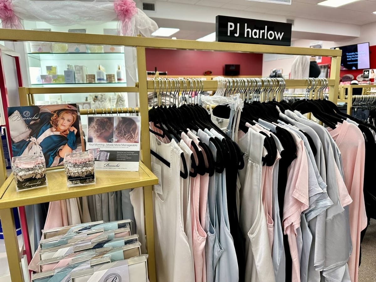 Assortment of pj harlow loungewear displayed in a retail store.