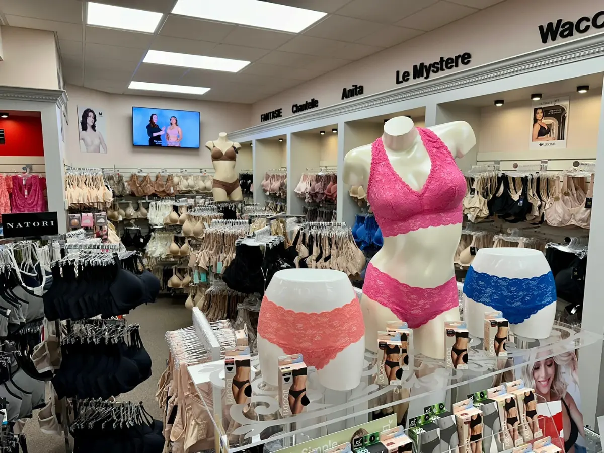 Lingerie shop with bras and underwear on display.