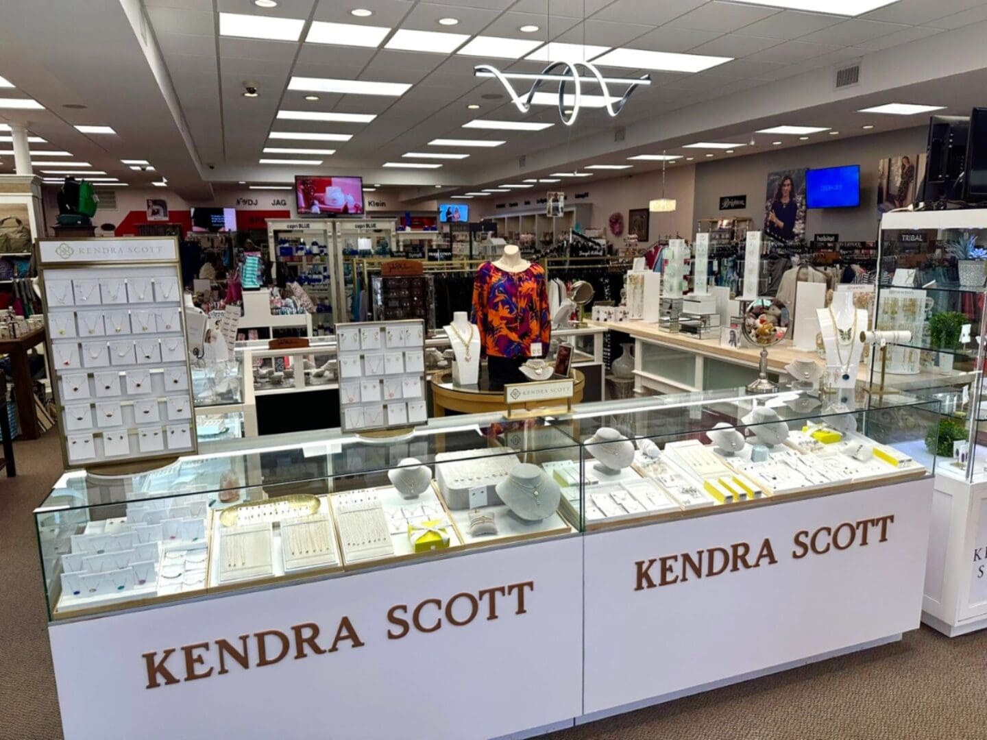 Elegant woman in black dress posing gracefully.